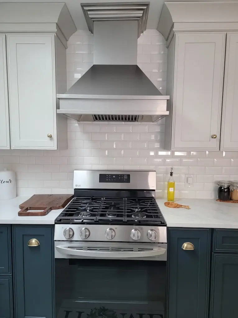 Modern stove range with professional vent hood and gas connections